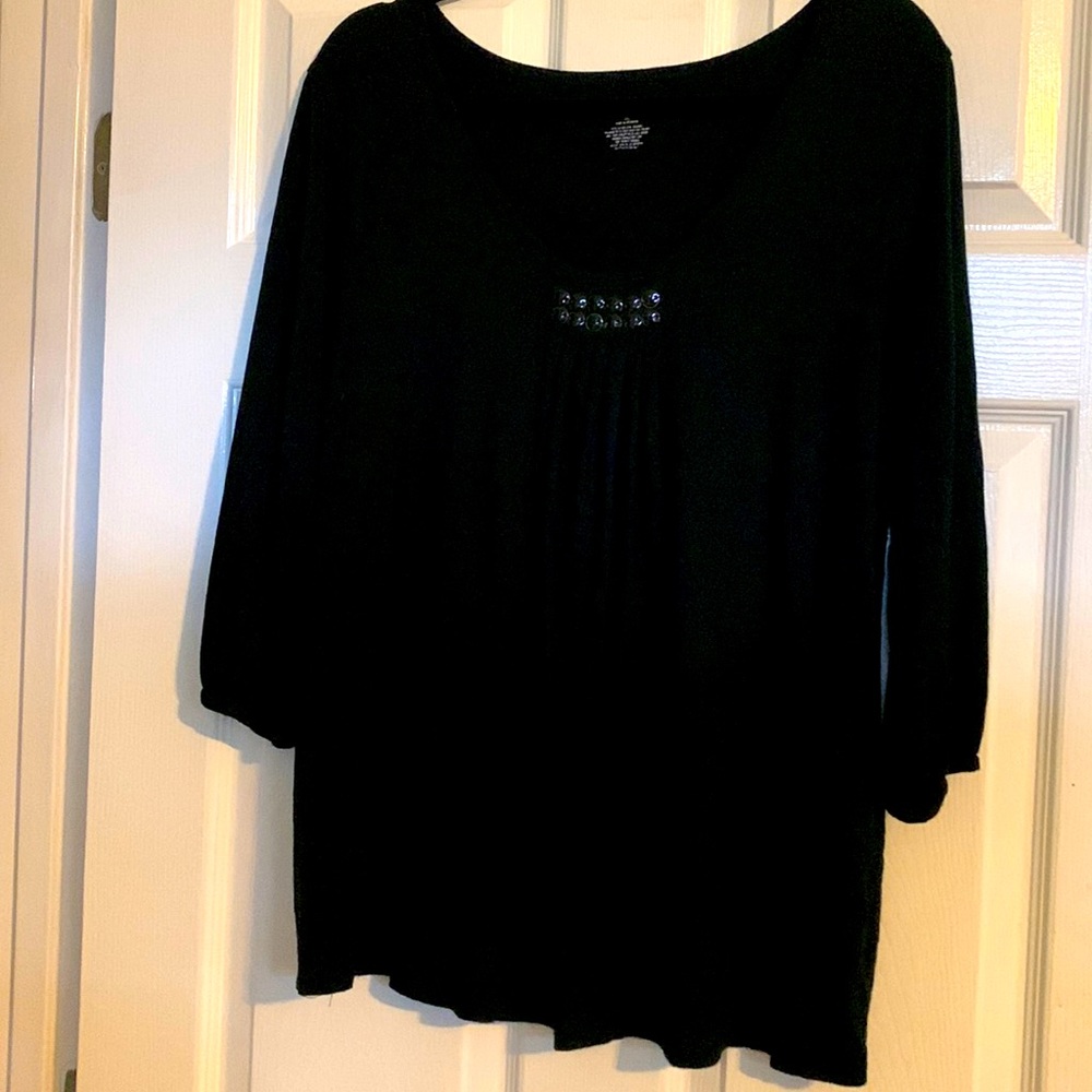Black casual shirt with pleated front and decorative neckline.